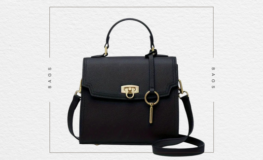 Black structured crossbody bag with gold accents on a white background, featuring 'The Sunday Club' branding.